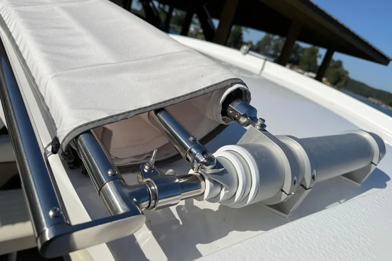 Slide: The Image of Close-up of a 2021 Cobalt R30 boat's stainless steel fittings and canvas cover. - 29