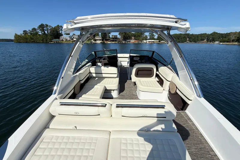 Slide: The Image of 2021 Cobalt R30 boat with spacious seating on a serene lake. - 4