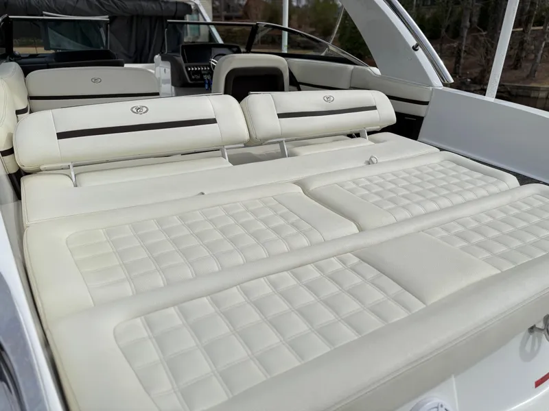 Slide: The Image of Luxurious white seating on a 2021 Cobalt R30 boat, featuring quilted upholstery. - 5