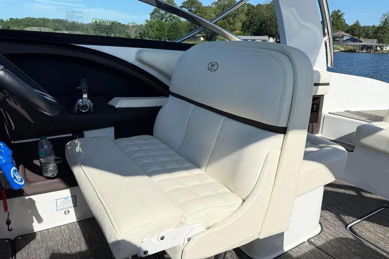 Slide: The Image of Luxurious interior of 2021 Cobalt R30 boat with plush seating and scenic lake view. - 9