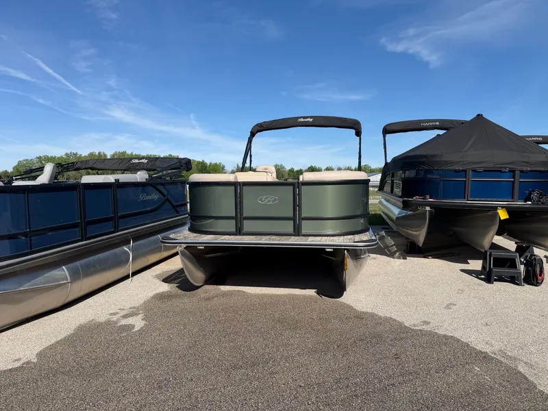 Slide: The Image of 2026 Bentley Pontoons LE 200 CR on parking lot under blue sky. - 2