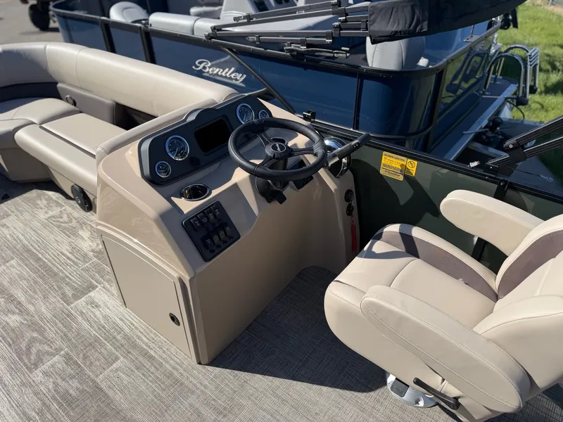Slide: The Image of Interior of 2026 Bentley Pontoons LE 200 CR with steering console. - 8