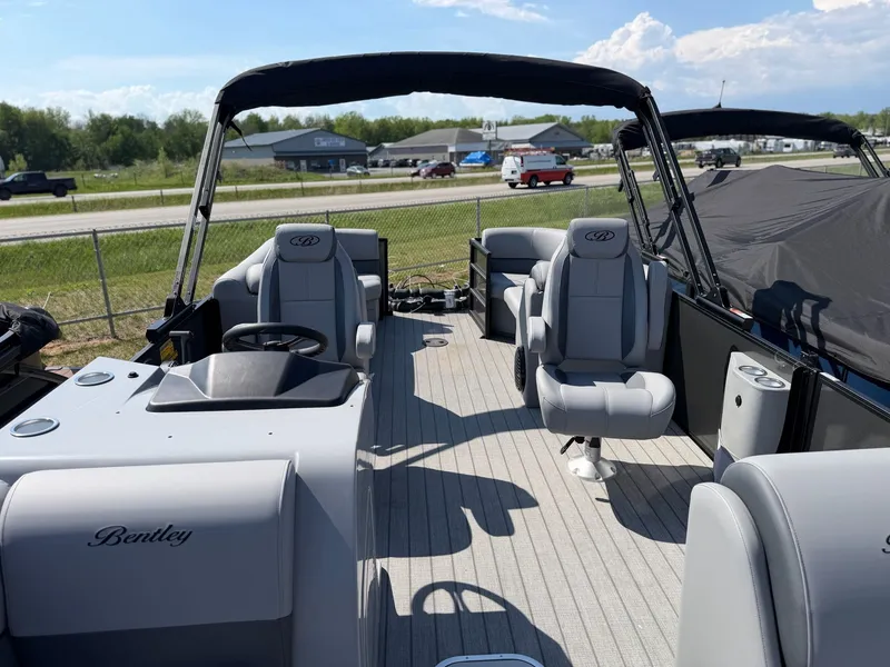 Slide: The Image of 2026 Bentley Pontoons LEGACY 243 NAVIGATOR interior view, luxurious seating and helm. - 5
