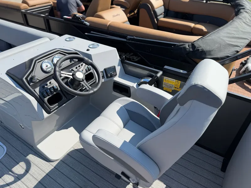 Slide: The Image of 2026 Bentley Pontoons LEGACY 243 NAVIGATOR helm with gray seat. - 7