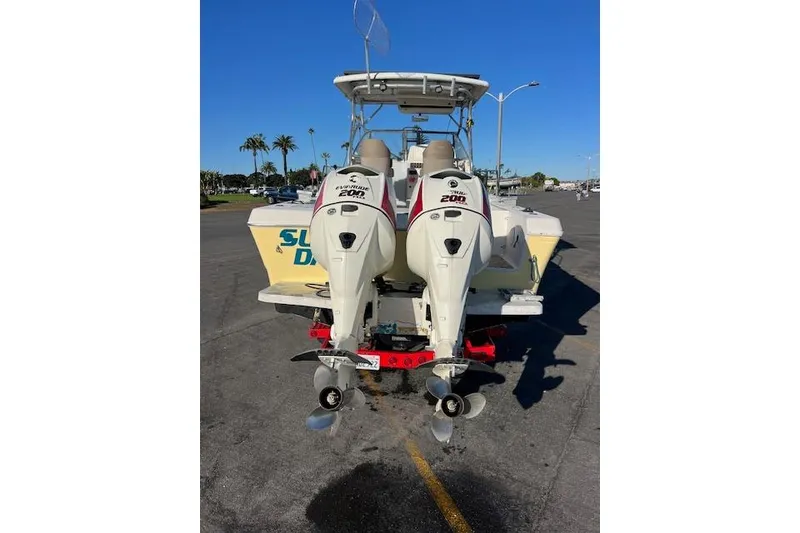 Slide: The Image of 1998 Pro-Line 2610 Walkaround boat with dual Evinrude 200 HP outboard motors. - 31