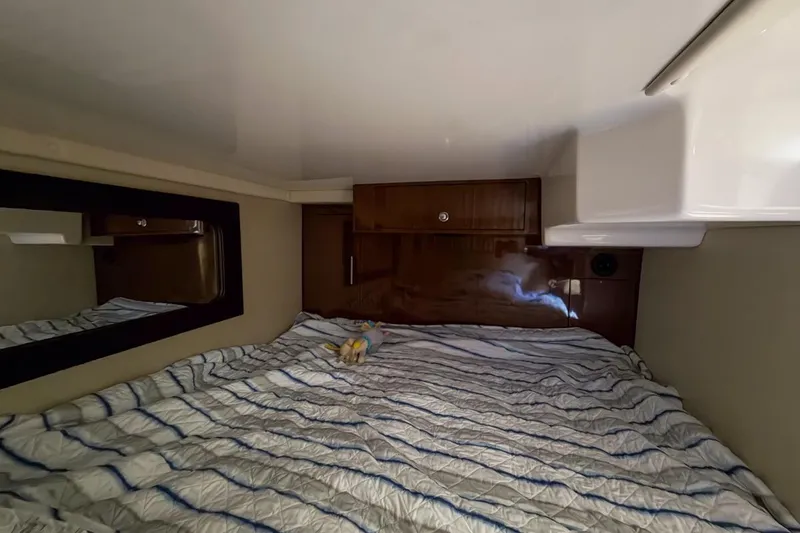 Slide: The Image of Interior of 2015 Regal 38 Express yacht with beige seating and wooden accents. - 104