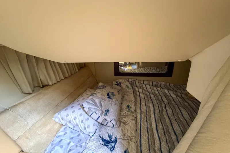 Slide: The Image of Luxurious interior of 2015 Regal 38 Express yacht with beige seating and wooden table. - 105