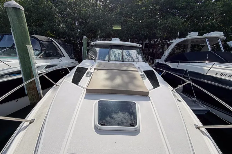 Slide: The Image of 2015 Regal 38 Express boat deck with hatch and railing, viewed from above. - 32