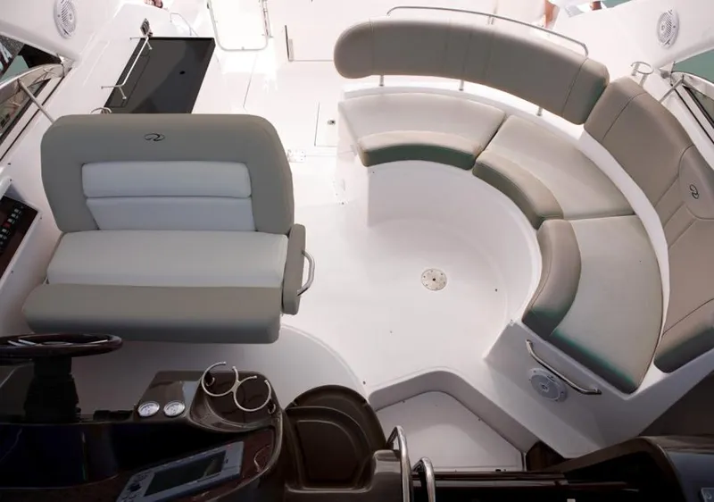 Slide: The Image of 2015 Regal 38 Express yacht docked with black canopy and blue fenders. - 5