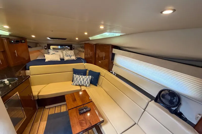 Slide: The Image of Interior of 2015 Regal 38 Express yacht with steering wheel and mounted TV. - 74