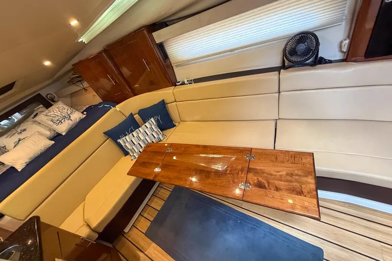 Slide: The Image of Cozy cabin interior of 2015 Regal 38 Express with nautical-themed bedding. - 81