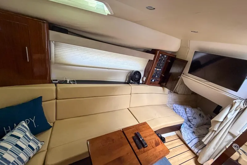 Slide: The Image of 2015 Regal 38 Express yacht kitchen with microwave, stove, and sink. - 99