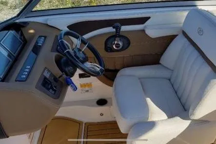 Slide: The Image of 2018 Cobalt 25SC boat interior with steering wheel and control panel. - 3