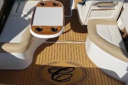 Slide: The Image of 2018 Cobalt 25SC boat interior with teak flooring and cushioned seating. - 4