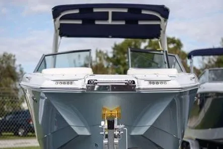 Slide: The Image of 2018 Cobalt 25SC boat with open bow, docked outdoors. - 5