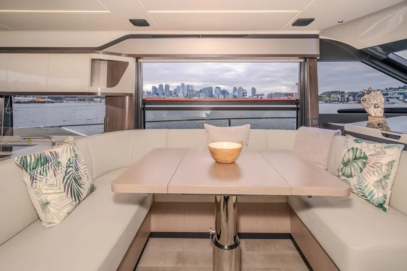 Slide: The Image of Luxurious interior of 2026 Absolute 48 Coupe yacht with city skyline view. - 20