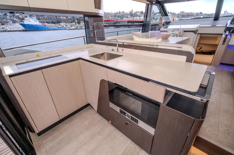 Slide: The Image of Modern kitchen interior of 2026 Absolute 48 Coupe yacht with sleek design and waterfront view. - 31