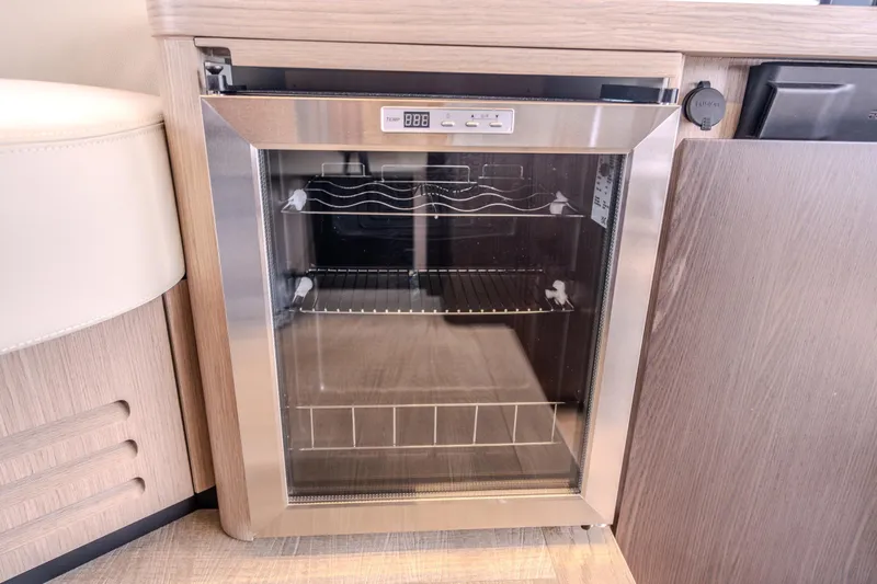 Slide: The Image of Compact glass-door refrigerator in 2026 Absolute 48 Coupe yacht interior. - 35