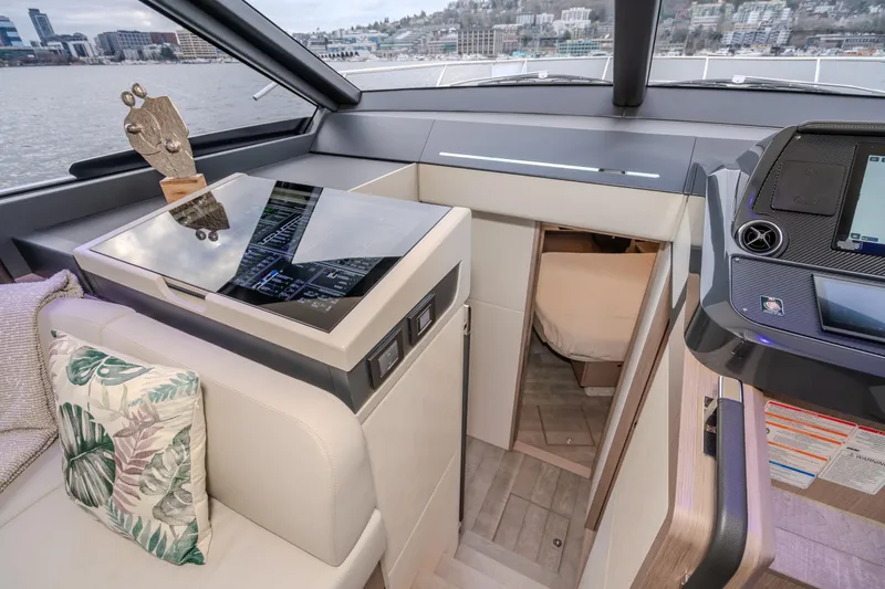 Slide: The Image of Interior of 2026 Absolute 48 Coupe yacht with modern design and scenic view. - 38
