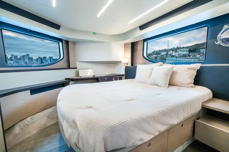 Slide: The Image of Luxurious bedroom interior of 2026 Absolute 48 Coupe yacht with cityscape views. - 39
