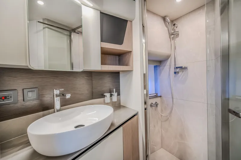 Slide: The Image of Modern bathroom in 2026 Absolute 48 Coupe yacht with sleek fixtures and shower. - 42