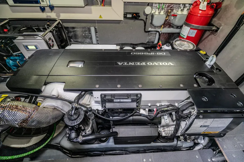 Slide: The Image of Engine room of 2026 Absolute 48 Coupe featuring Volvo Penta D8-IPS650 engine. - 52