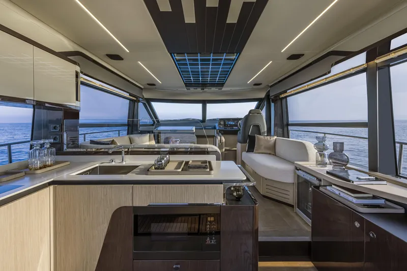 Slide: The Image of 2026 Absolute 48 Coupe yacht with solar panels on deck, cruising on a calm lake. - 8