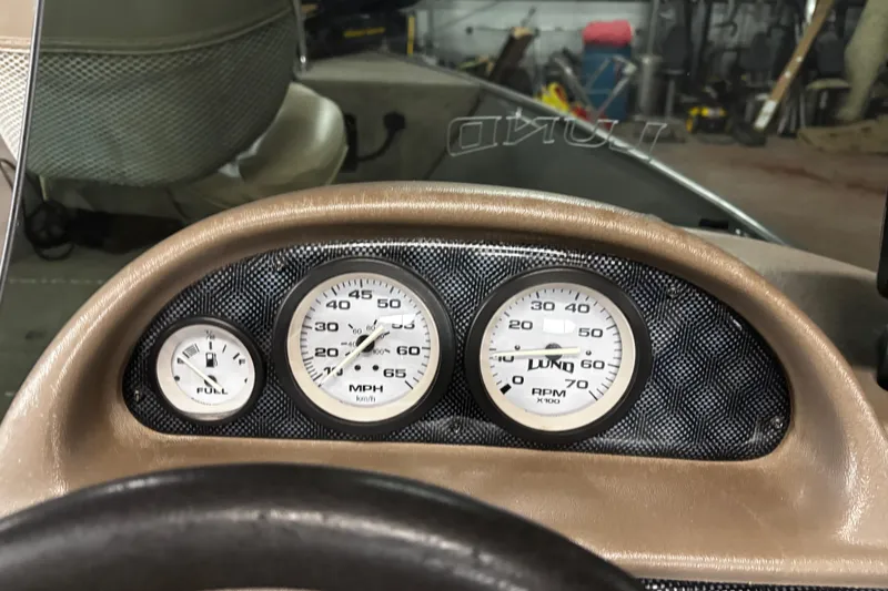 Slide: The Image of 2003 Lund 1650 Explorer SS boat interior with seats and Yamaha 50 outboard motor. - 11