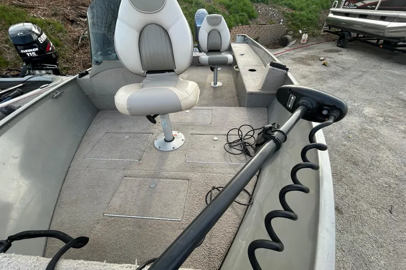 Slide: The Image of 2003 Lund 1650 Explorer SS boat interior with seats and motor. - 30