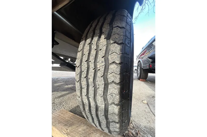 Slide: The Image of Close-up of a worn tire on a 2003 Lund 1650 Explorer SS trailer. - 34
