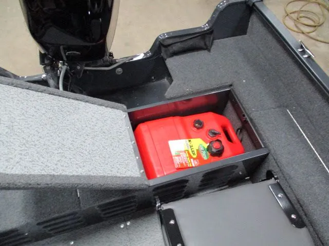 Slide: The Image of Lund 1650 Angler SS 2026 with red fuel tank in storage compartment. - 6