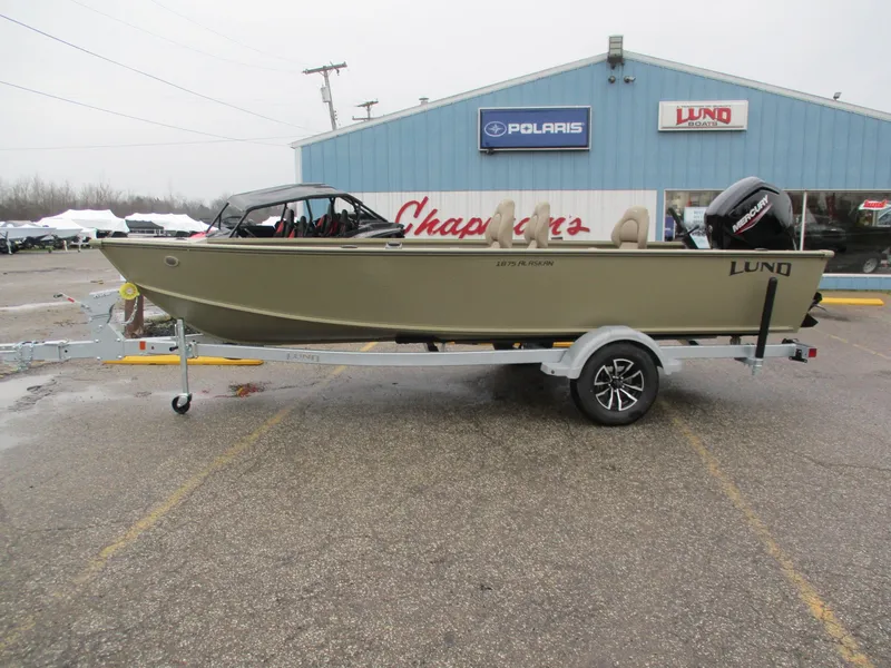 Slide: The Image of 2026 Lund Alaskan 1875 Tiller boat on trailer outside a store. - 9