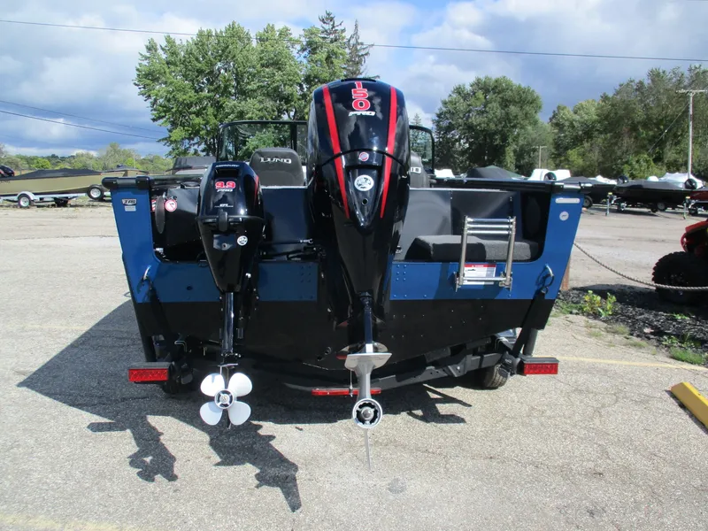 Slide: The Image of Rear view of 2026 Lund 1875 Fisherman with dual outboard motors. - 8