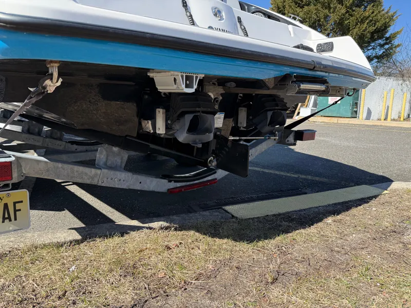Slide: The Image of 2023 Yamaha Boats AR250 on trailer, rear view showing dual engines and hull design. - 11