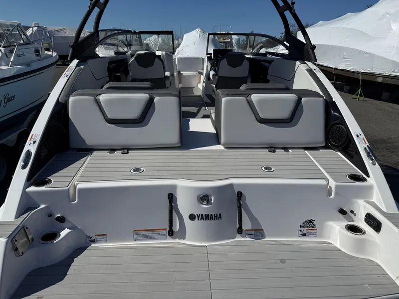 Slide: The Image of 2023 Yamaha Boats AR250, rear view, showcasing seating and deck layout. - 16