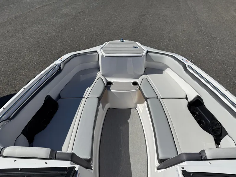 Slide: The Image of 2023 Yamaha Boats AR250 interior with spacious seating and modern design. - 17
