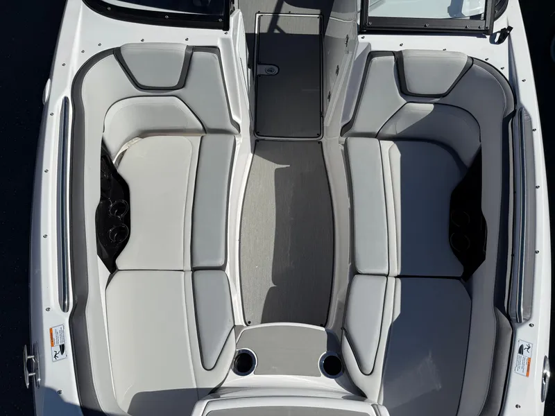 Slide: The Image of 2023 Yamaha Boats AR250 interior with spacious seating and modern design. - 20