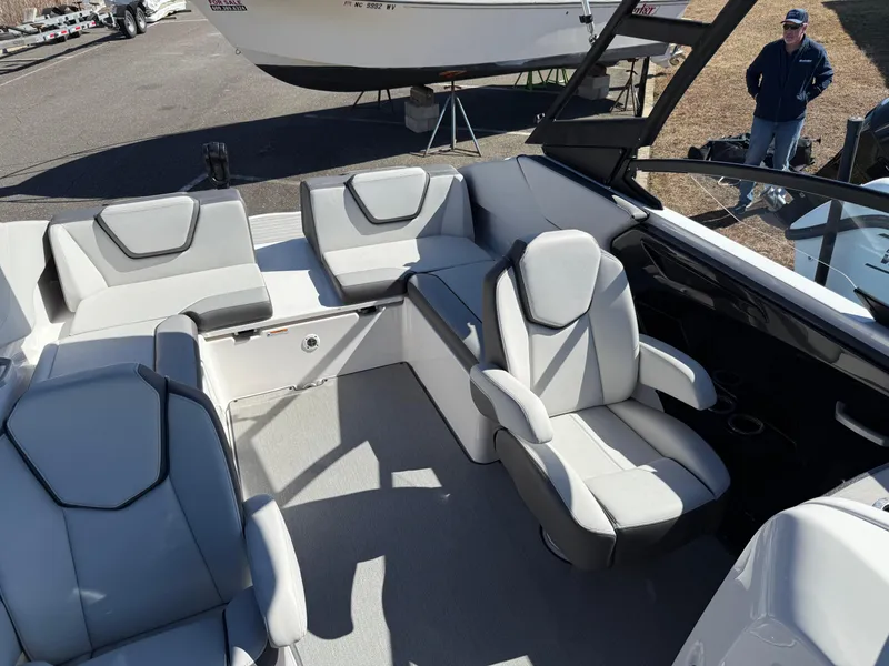 Slide: The Image of 2023 Yamaha Boats AR250 interior with modern seating and sleek design. - 23