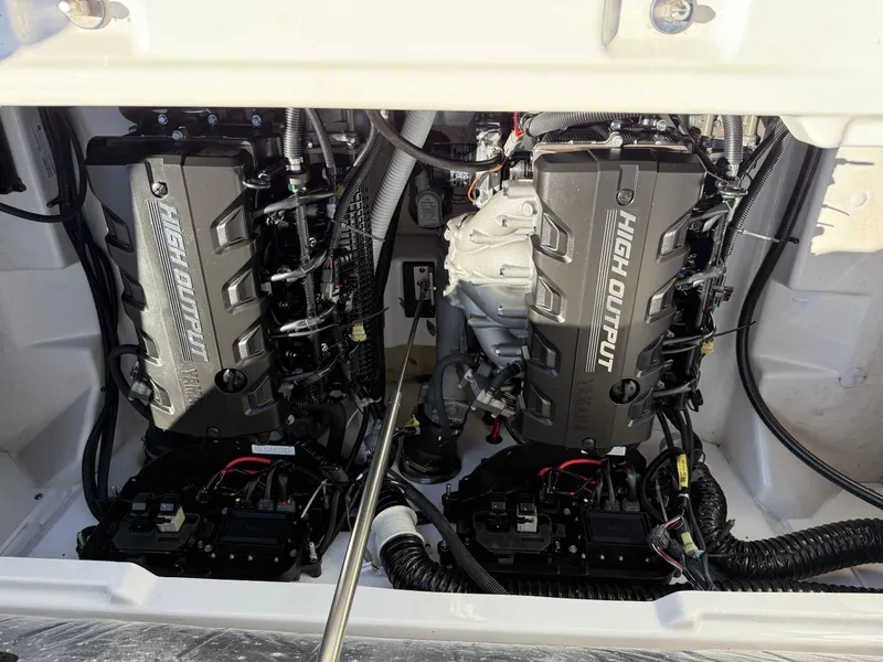 Slide: The Image of 2023 Yamaha Boats AR250 engine compartment with dual high-output engines. - 24