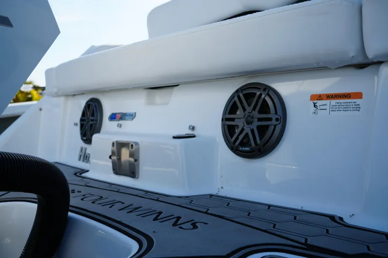 Slide: The Image of 2026 Four Winns HD3 OB boat deck with speakers and warning label. - 10