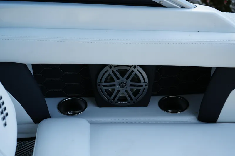 Slide: The Image of 2026 Four Winns HD3 OB boat interior with speaker and cup holders. - 16