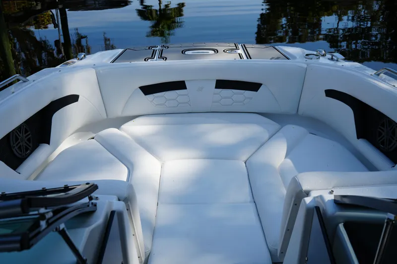 Slide: The Image of 2026 Four Winns HD3 OB boat interior with white seating and sleek design. - 18