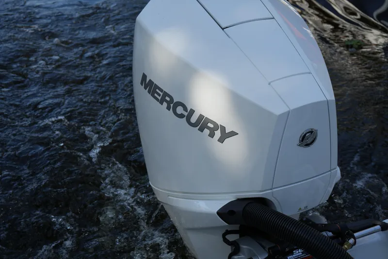 Slide: The Image of 2026 Four Winns HD3 OB with Mercury outboard engine on water. - 19