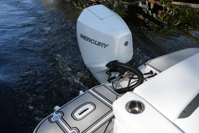 Slide: The Image of 2026 Four Winns HD3 OB boat with Mercury outboard motor on water. - 20