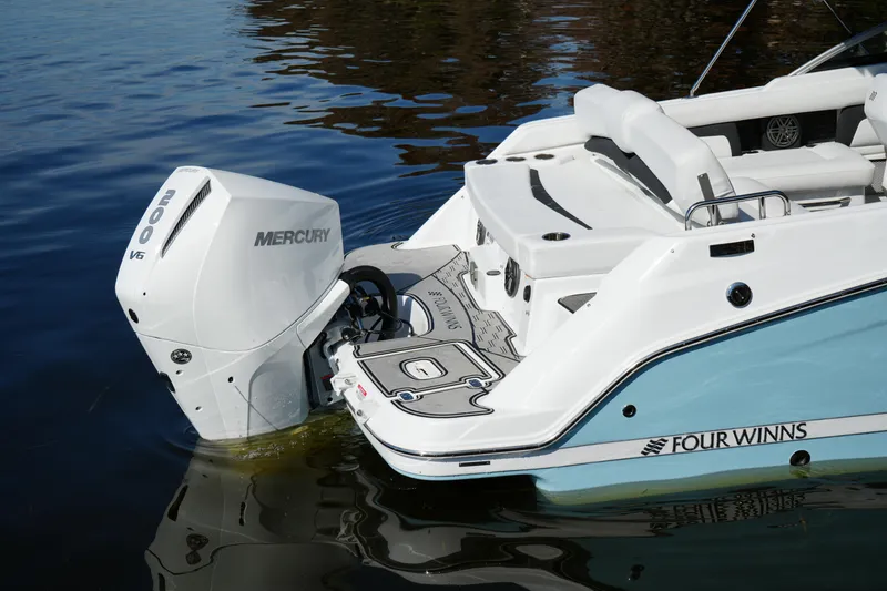Slide: The Image of 2026 Four Winns HD3 OB boat with Mercury 200 V6 engine on water. - 36