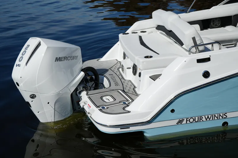 Slide: The Image of 2026 Four Winns HD3 OB boat with Mercury 200 V6 engine on water. - 37