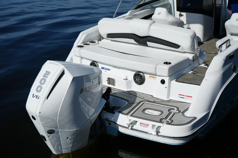 Slide: The Image of 2026 Four Winns HD3 OB boat with Mercury 200 V6 engine on calm water. - 41