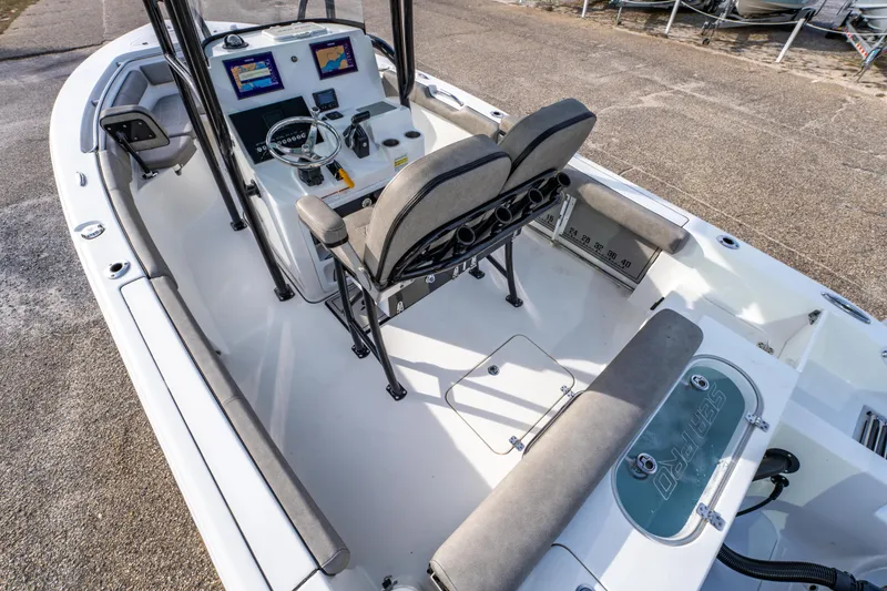Slide: The Image of 2021 Sea Pro 219 Center Console boat interior with dual screens and seating. - 18