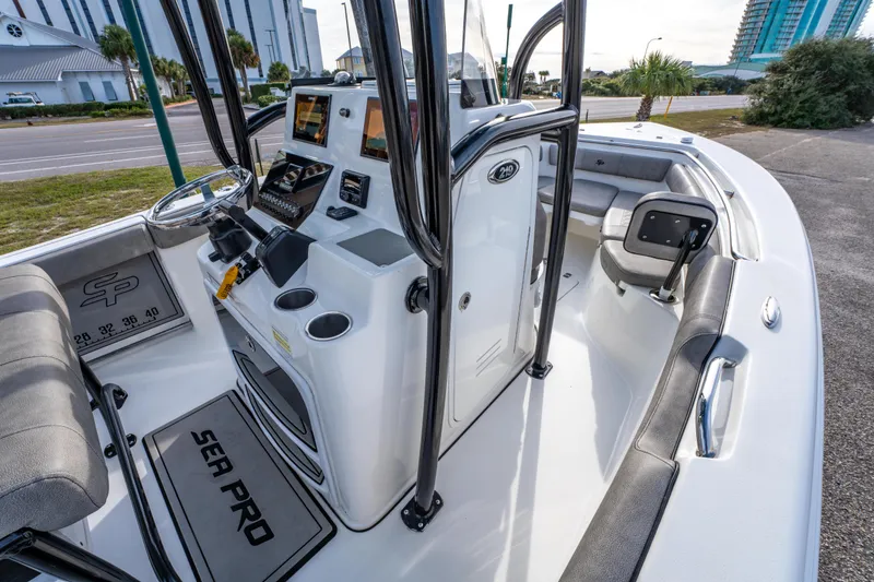 Slide: The Image of 2021 Sea Pro 219 Center Console boat interior with modern controls and seating. - 22
