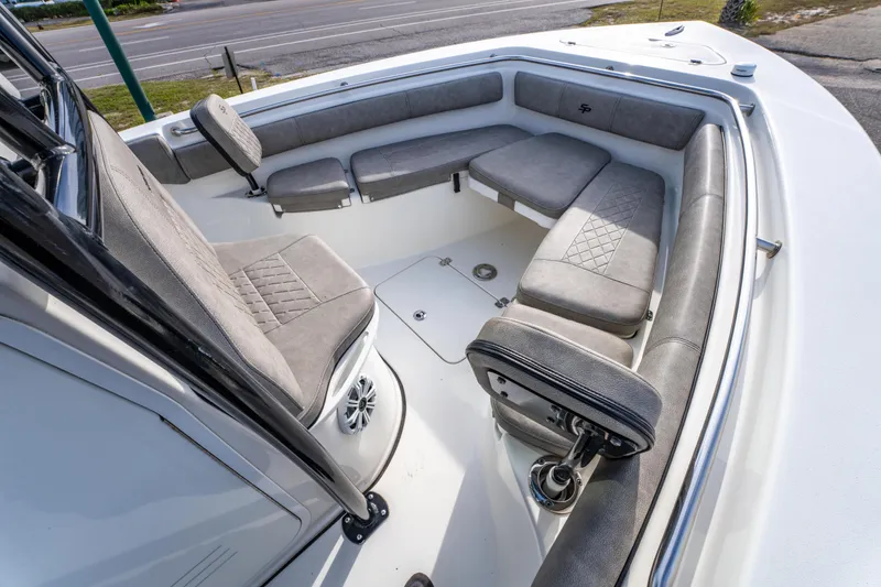 Slide: The Image of 2021 Sea Pro 219 Center Console boat interior with cushioned seating and modern design. - 25